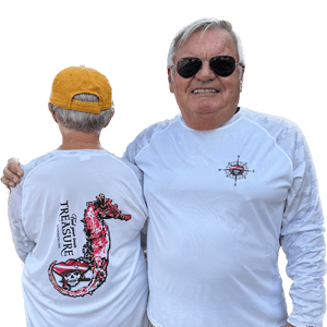 Gayle and Ed modeling white and grey 2023 membership shirt with pink seahorse design