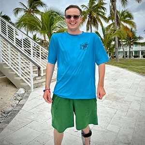 Lawton in a short sleeved Dark blue Performance shirt on Cayman Brac front