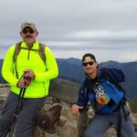 2020 recipient Scott Wilson with another gentlemen at the top of a mountain